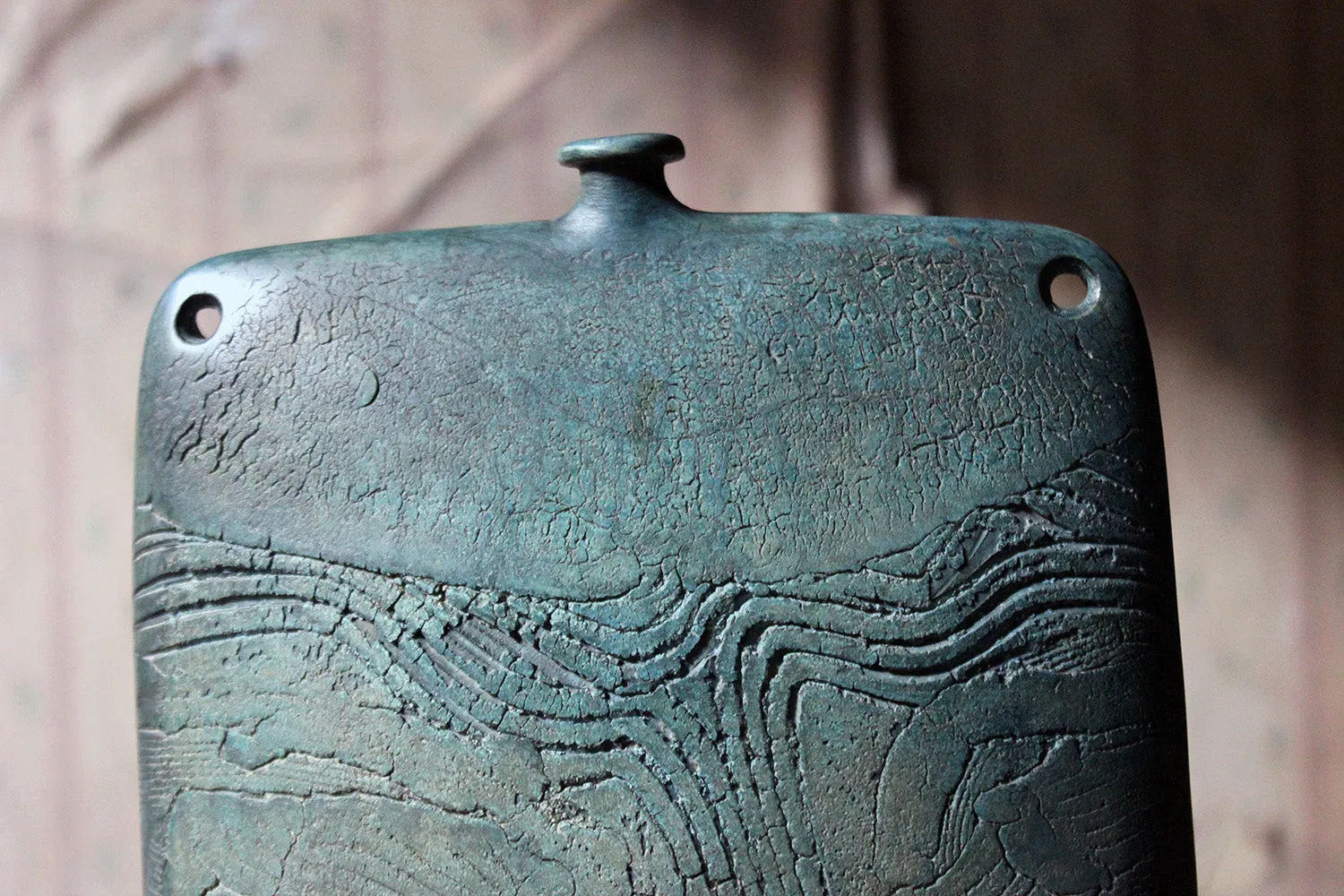 A Burnished Jade Green Bottle Vase by Peter Hayes c.1984
