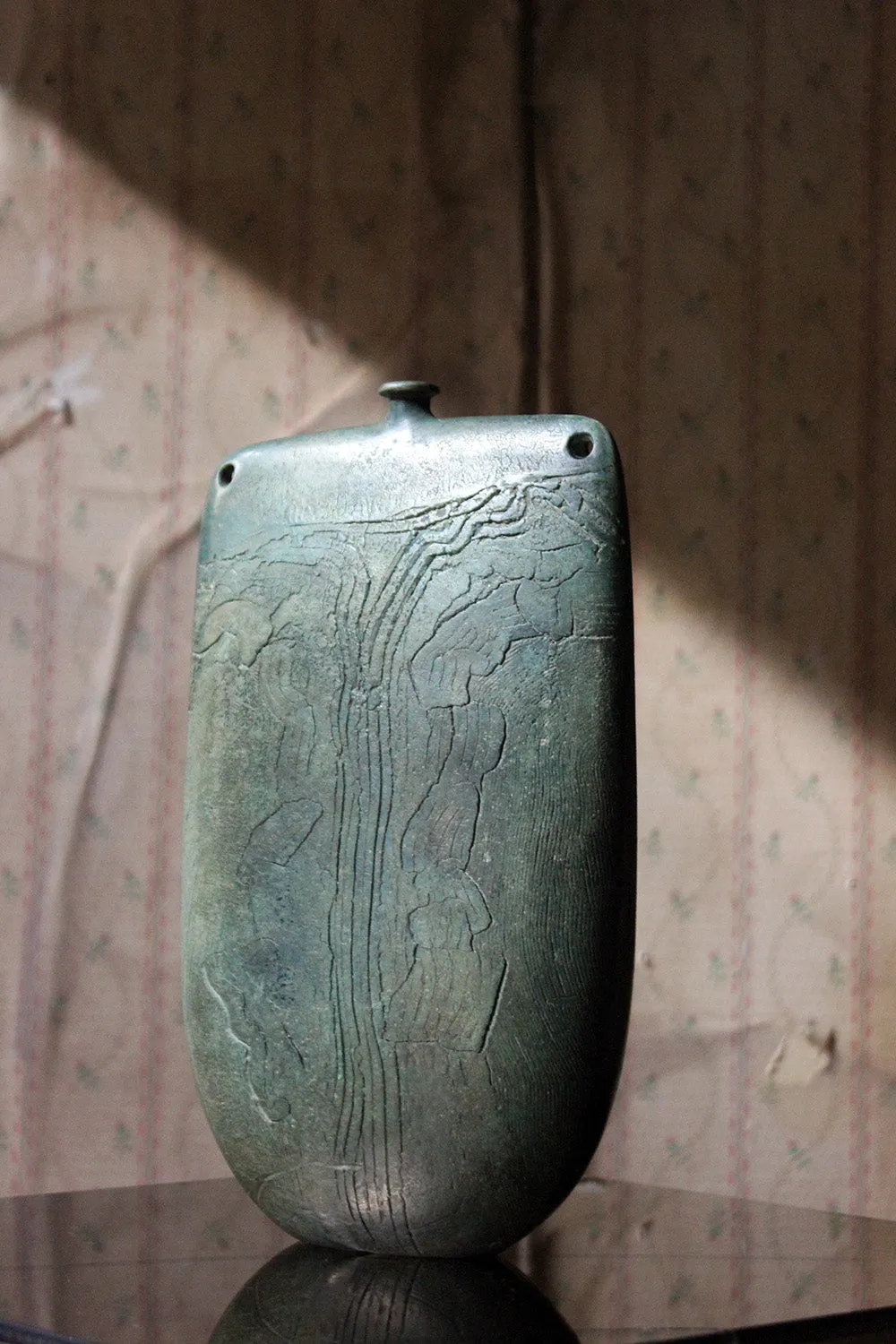 A Burnished Jade Green Bottle Vase by Peter Hayes c.1984
