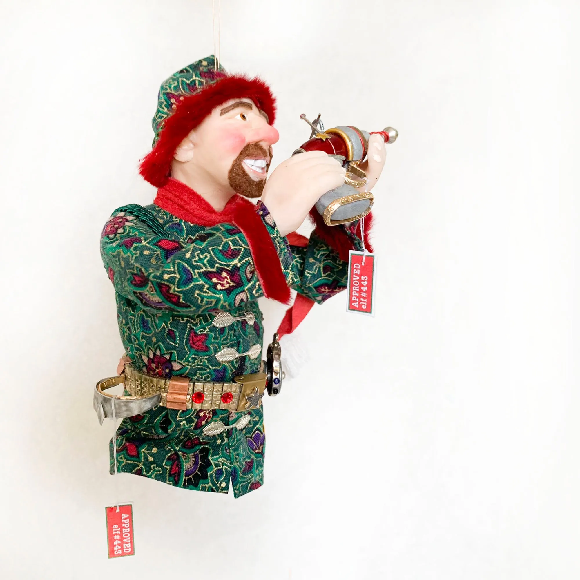 Christmas ornament - Spaceman Elf #443 inspecting a Ray Gun
