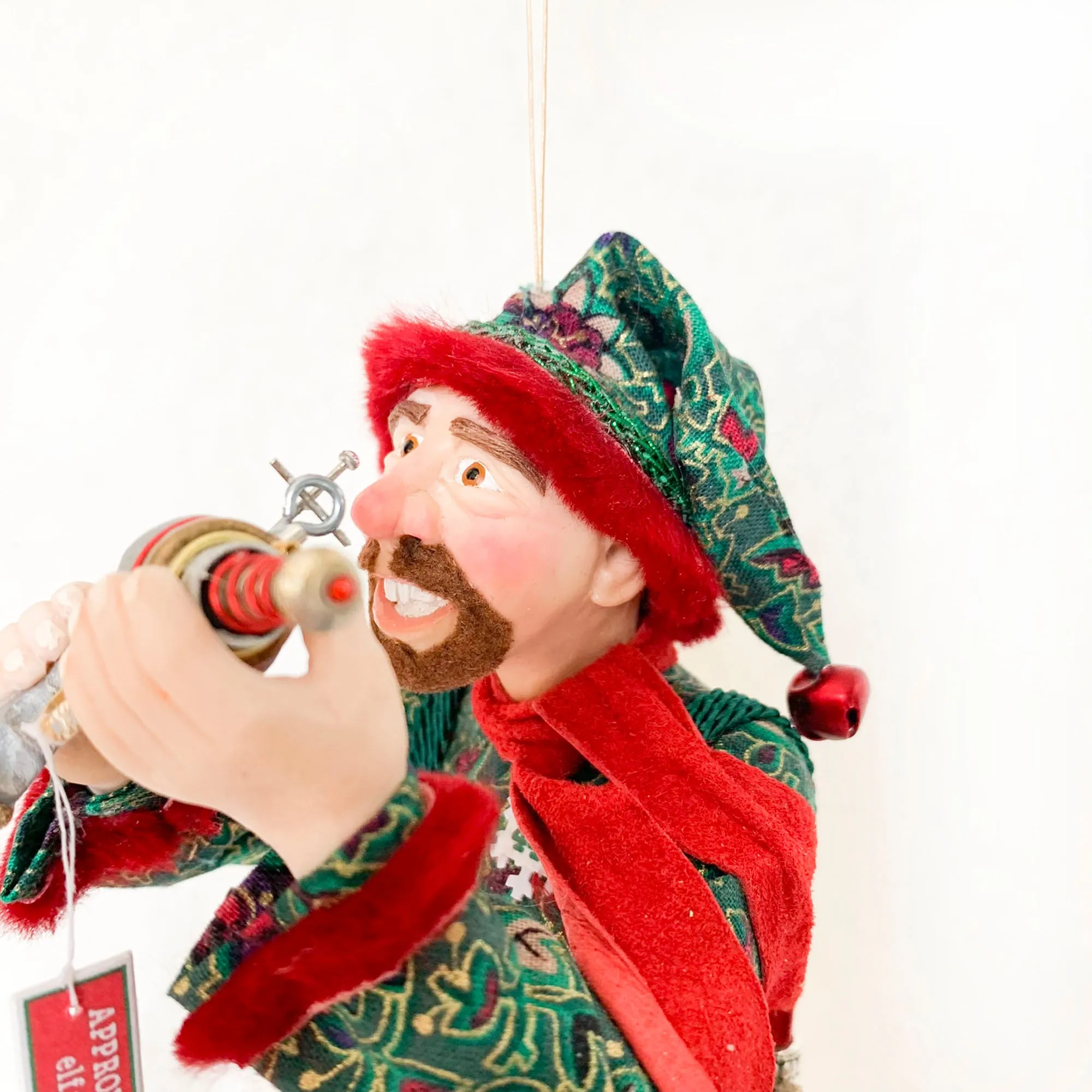 Christmas ornament - Spaceman Elf #443 inspecting a Ray Gun