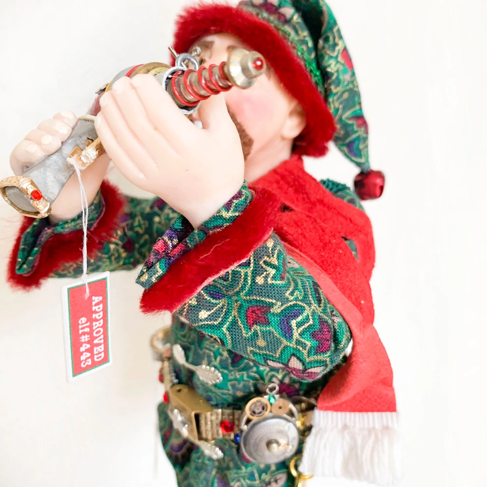 Christmas ornament - Spaceman Elf #443 inspecting a Ray Gun
