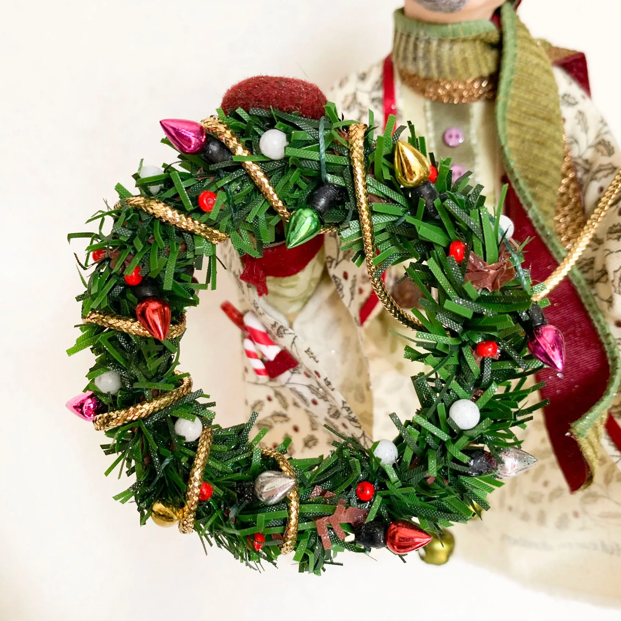 Christmas Trimming Elf decorating a pine wreath - Holiday decor