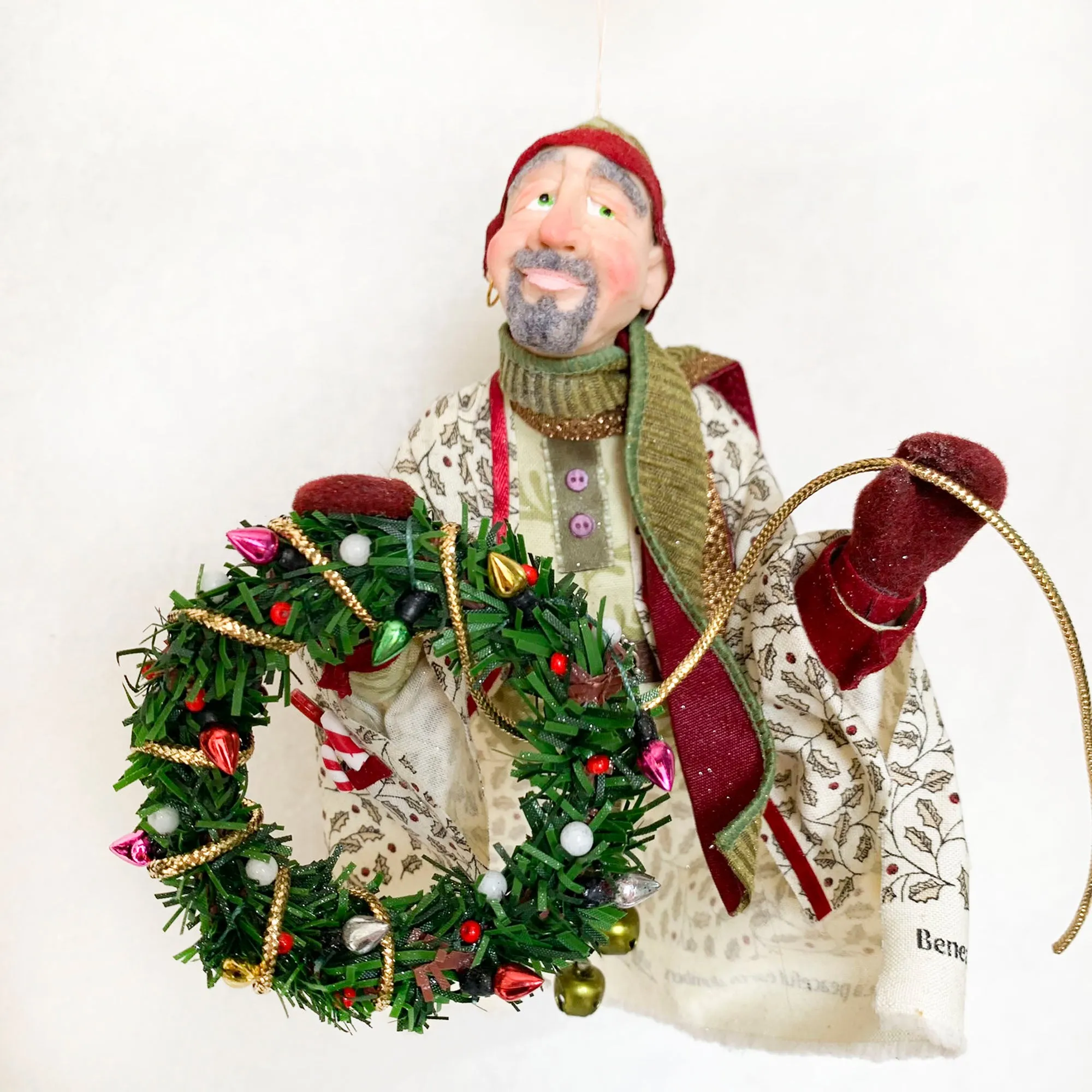 Christmas Trimming Elf decorating a pine wreath - Holiday decor