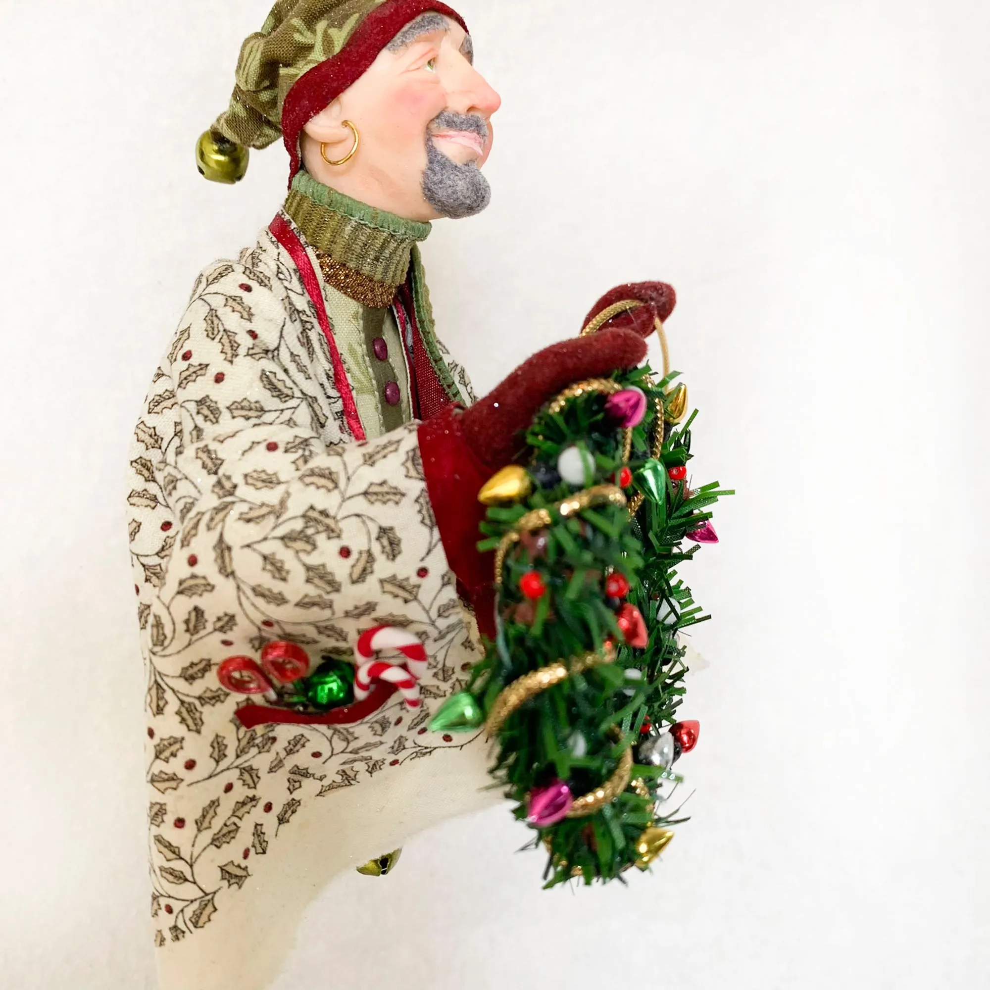 Christmas Trimming Elf decorating a pine wreath - Holiday decor