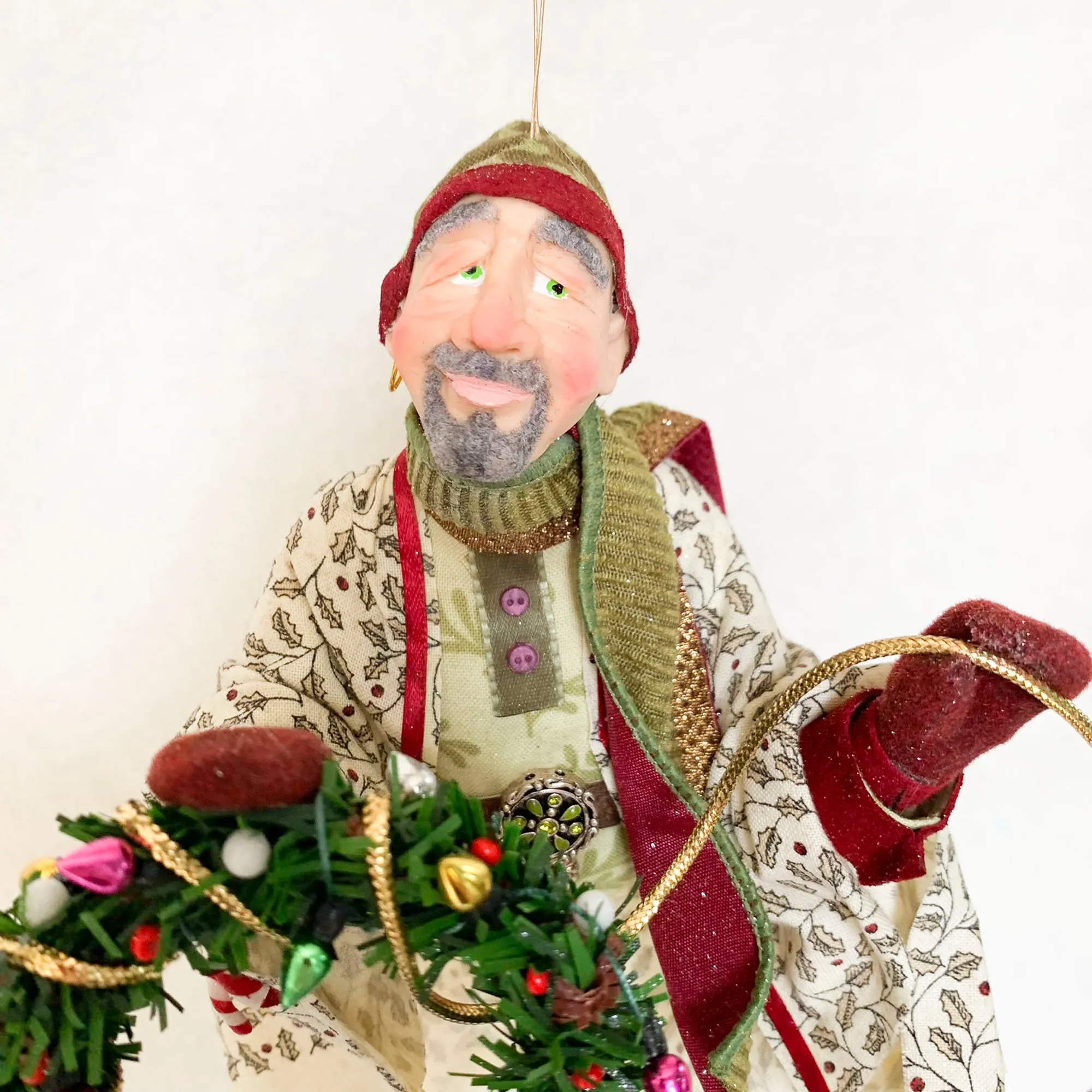 Christmas Trimming Elf decorating a pine wreath - Holiday decor