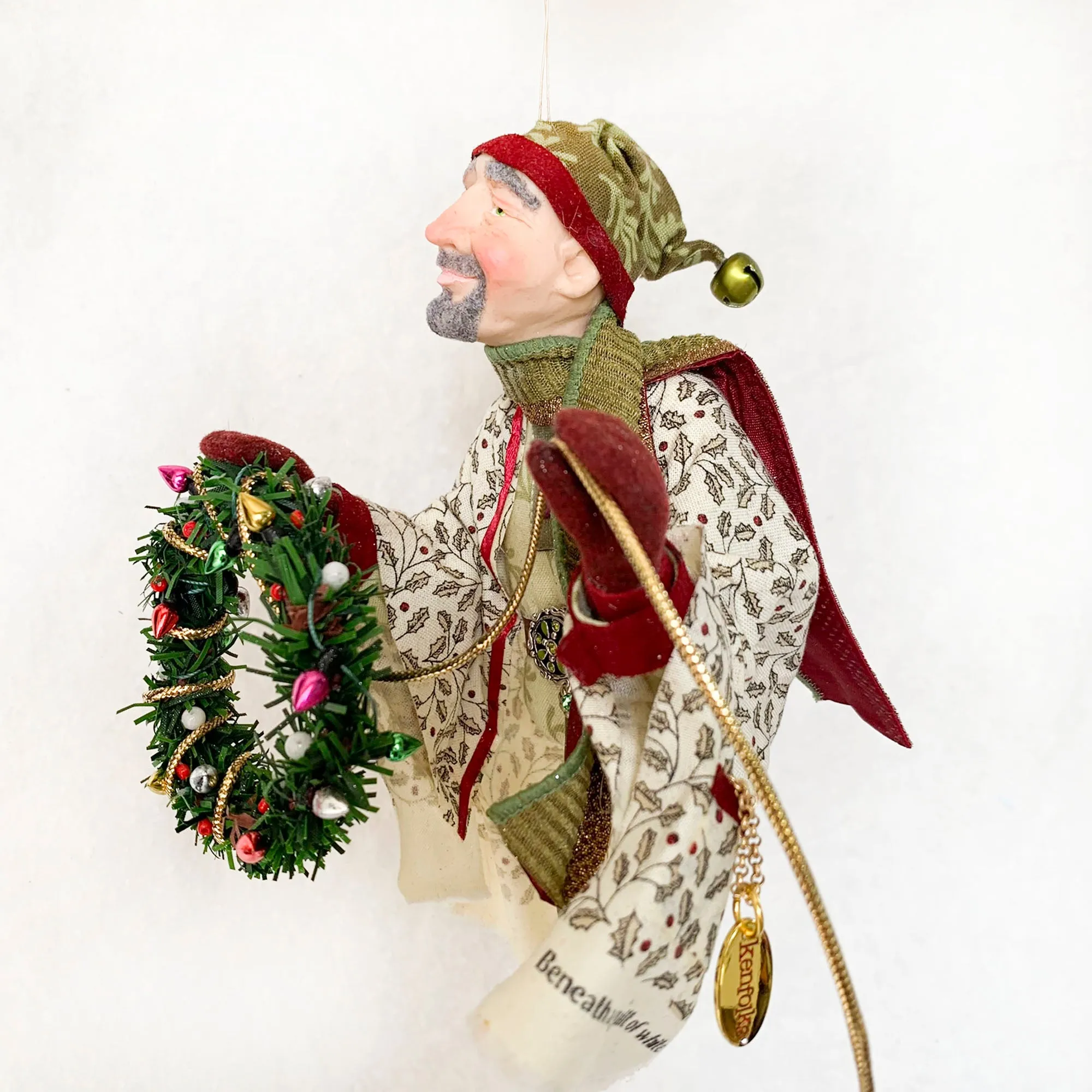Christmas Trimming Elf decorating a pine wreath - Holiday decor