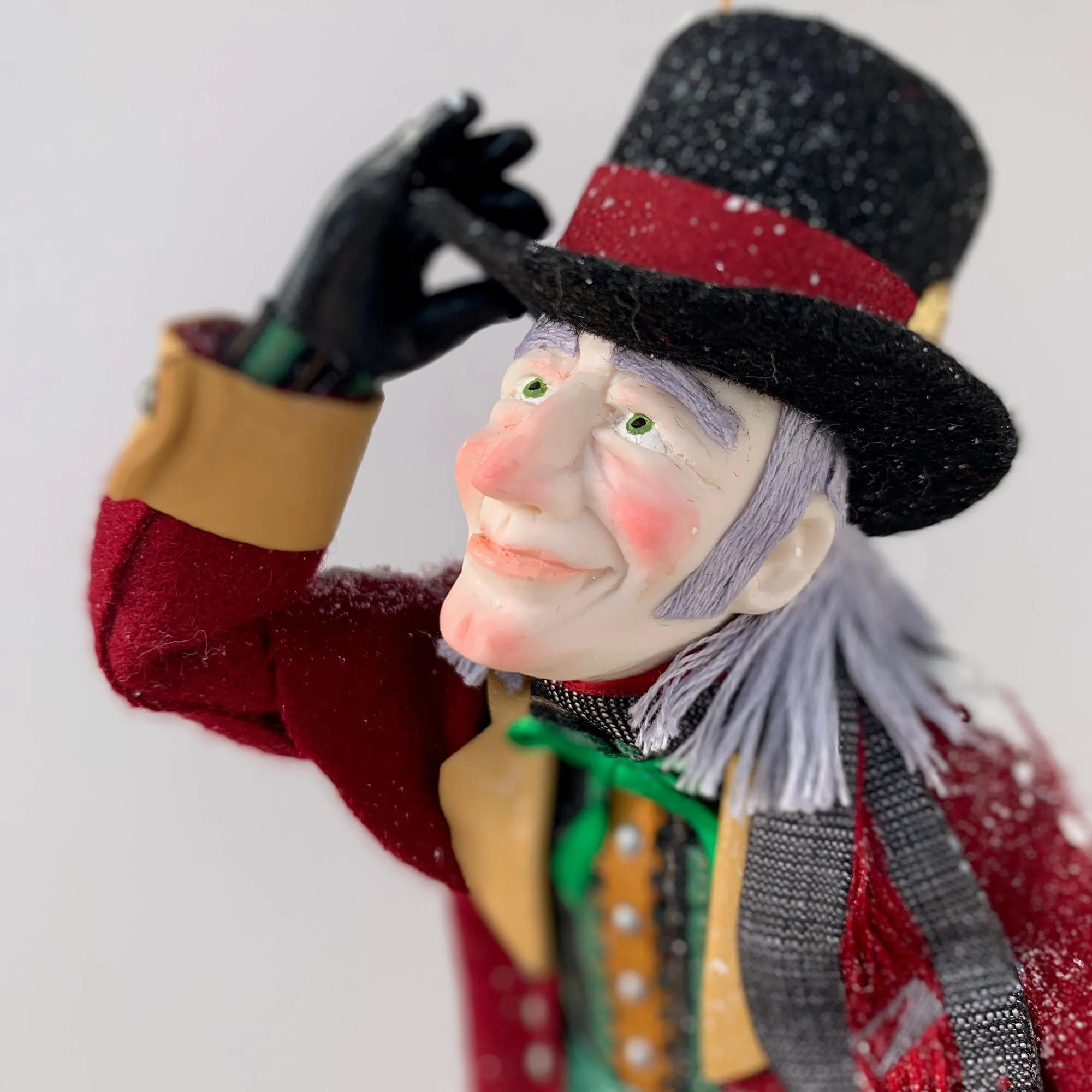 Happy Scrooge carrying a Christmas wreath and tipping his Top Hat - Dickens Collectable Christmas Decoration - Sculpture by Ken Fedoruk