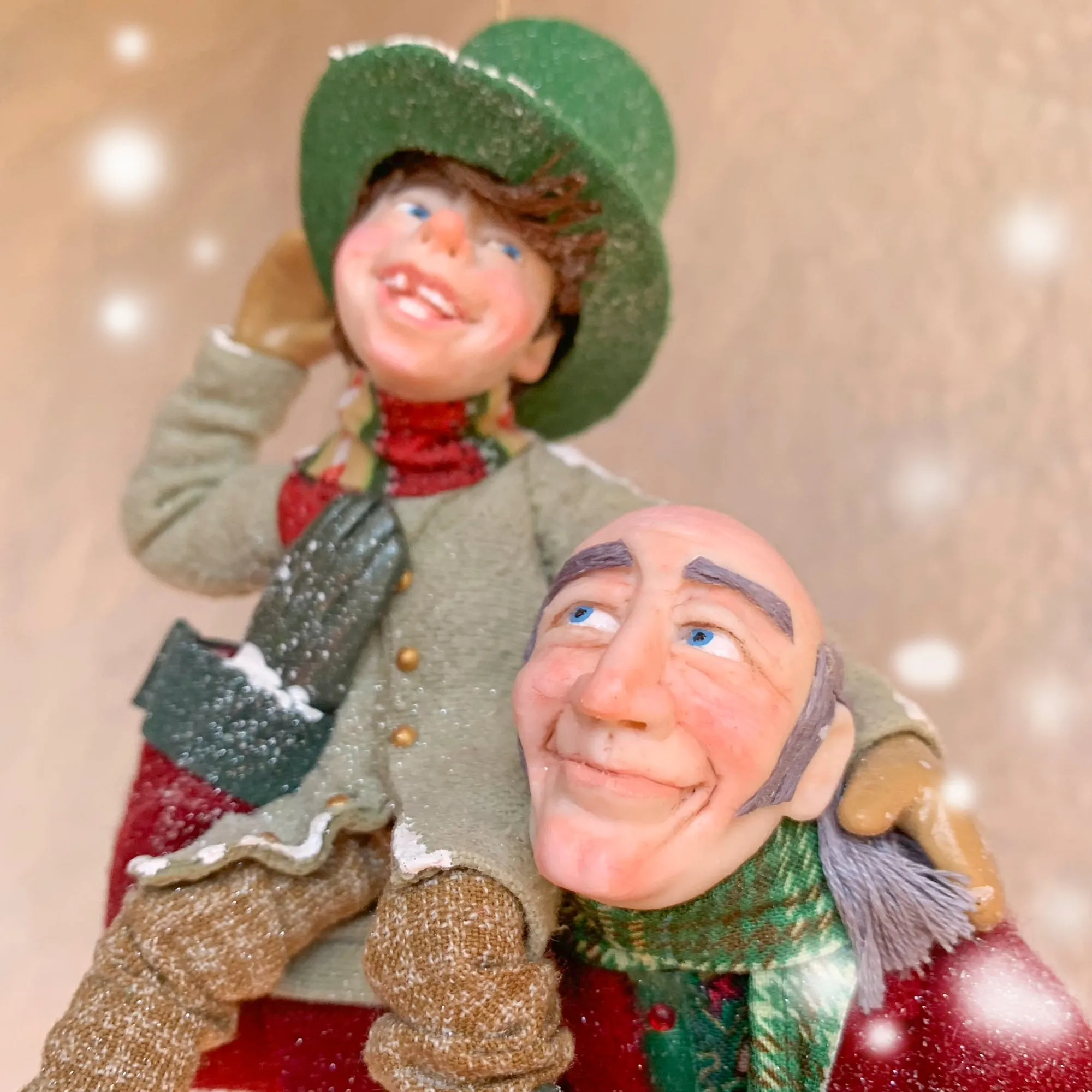 Scrooge a new man with Tiny Tim on his shoulder - Hanging Christmas Ornament