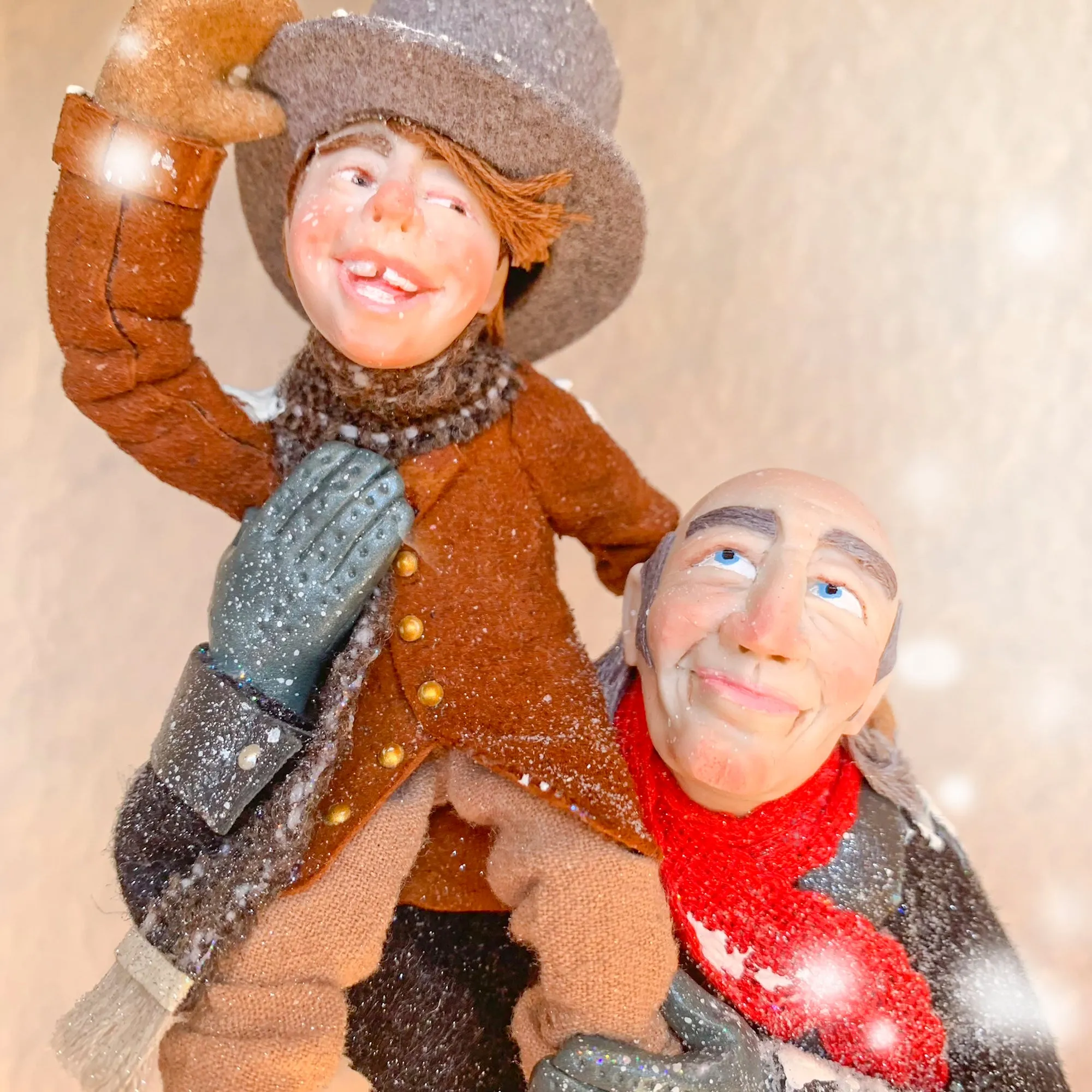 Scrooge a new man with Tiny Tim on his shoulder - Hanging Christmas Ornament